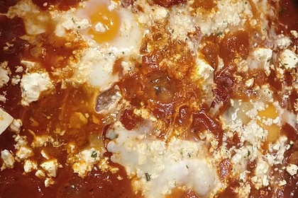 Eier in Tomatensugo (Bild)