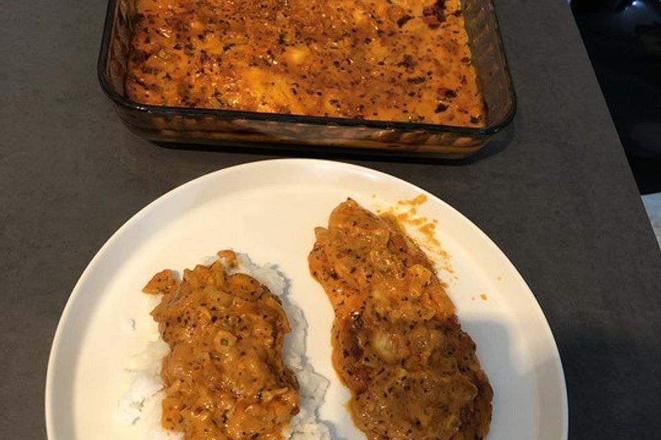 Pangasiusfilet in Weißwein - Sahnesoße mit Reis