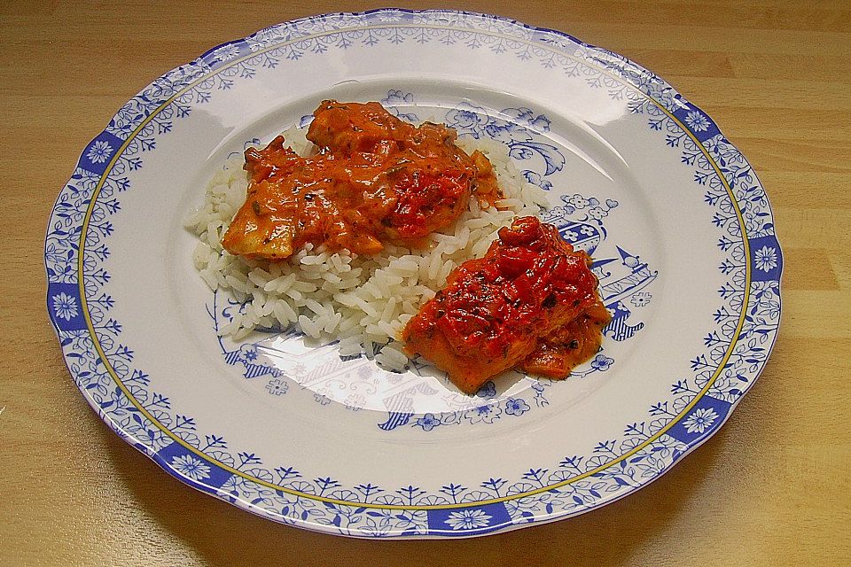 Pangasiusfilet in Weißwein - Sahnesoße mit Reis