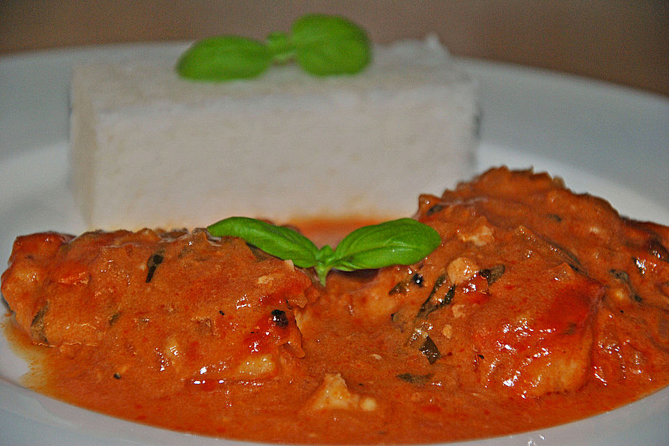 Pangasiusfilet in Weißwein - Sahnesoße mit Reis