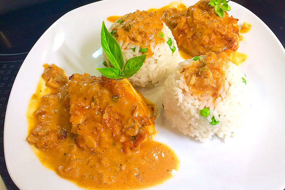 Pangasiusfilet in Weißwein - Sahnesoße mit Reis