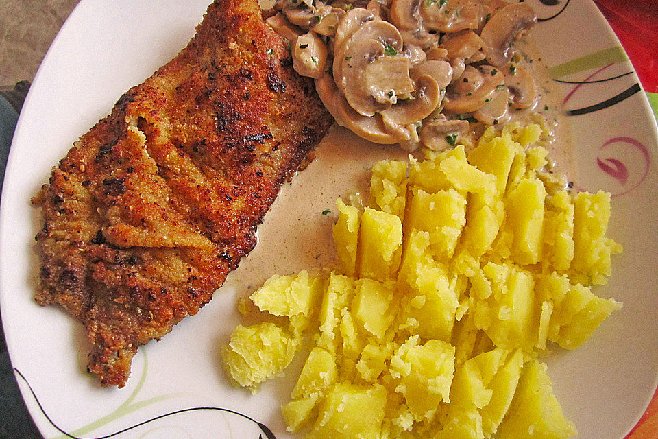 Schnitzel vom Schwein mit Champignons