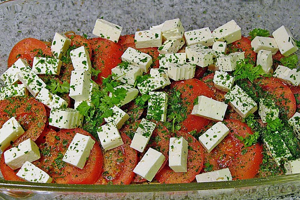 Fisch mit Zwiebeln und Tomaten