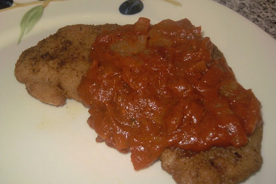 Schnitzelpfanne mit pikanter Sauce