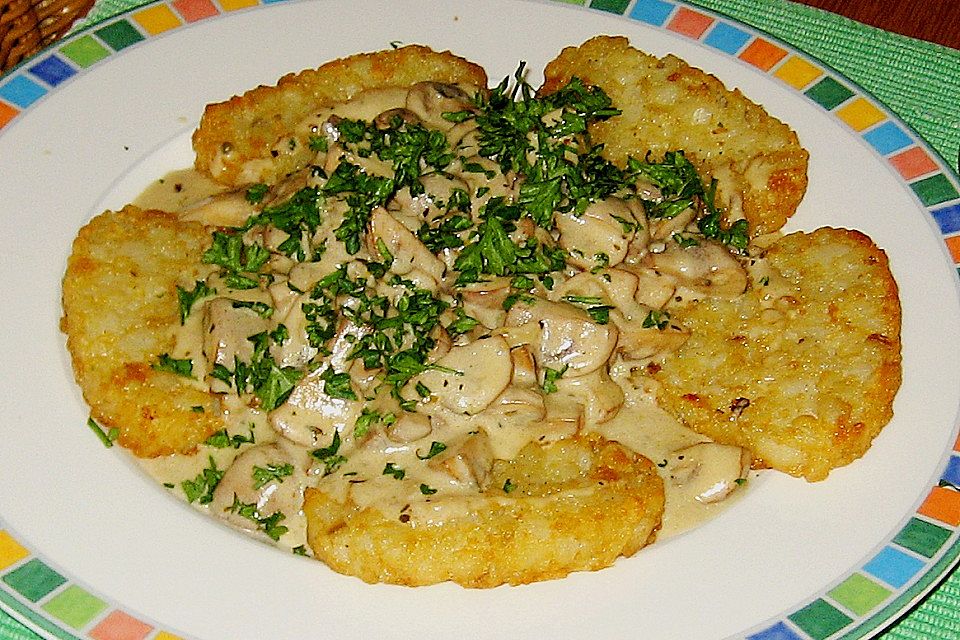 Champignons in Weißweinsauce auf Rösti