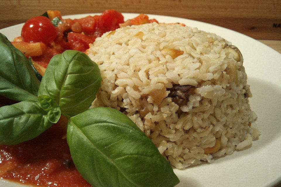 Gebratener Butterreis mit Champignons Gebratener Butterreis mit Champignons