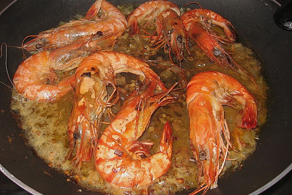 King Prawns in einem  Weißwein - Knoblauch - Sud