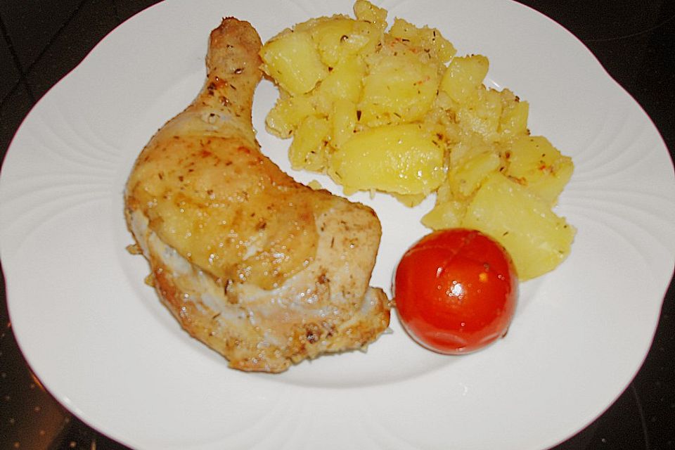 Provenzalische Hähnchenschenkel mit Knoblauchkartoffeln und Schmortomaten