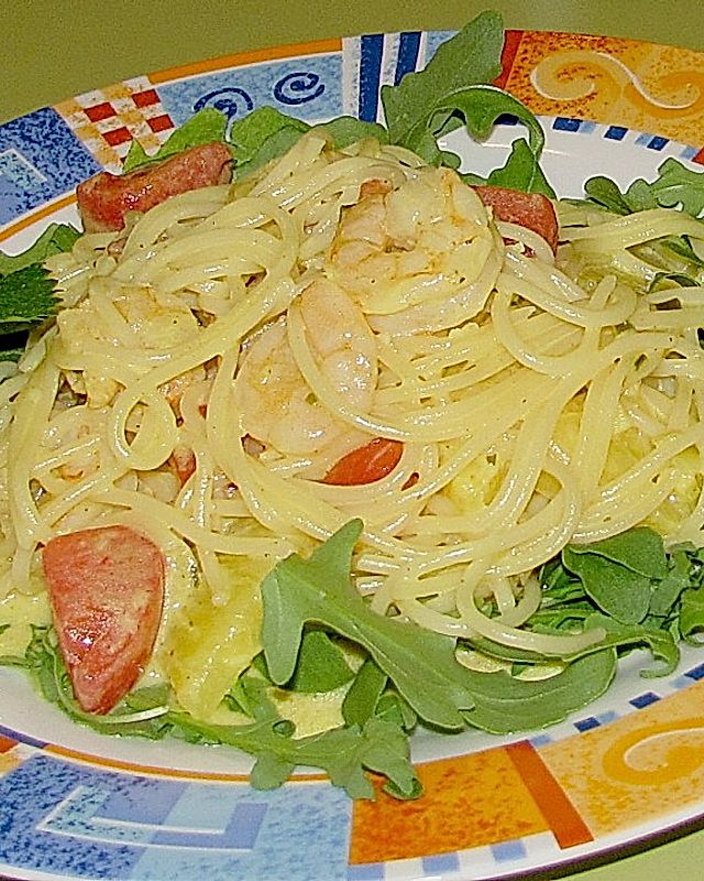 Spaghetti mit Riesengarnelen in Ananas - Ingwercreme auf Rucolabett