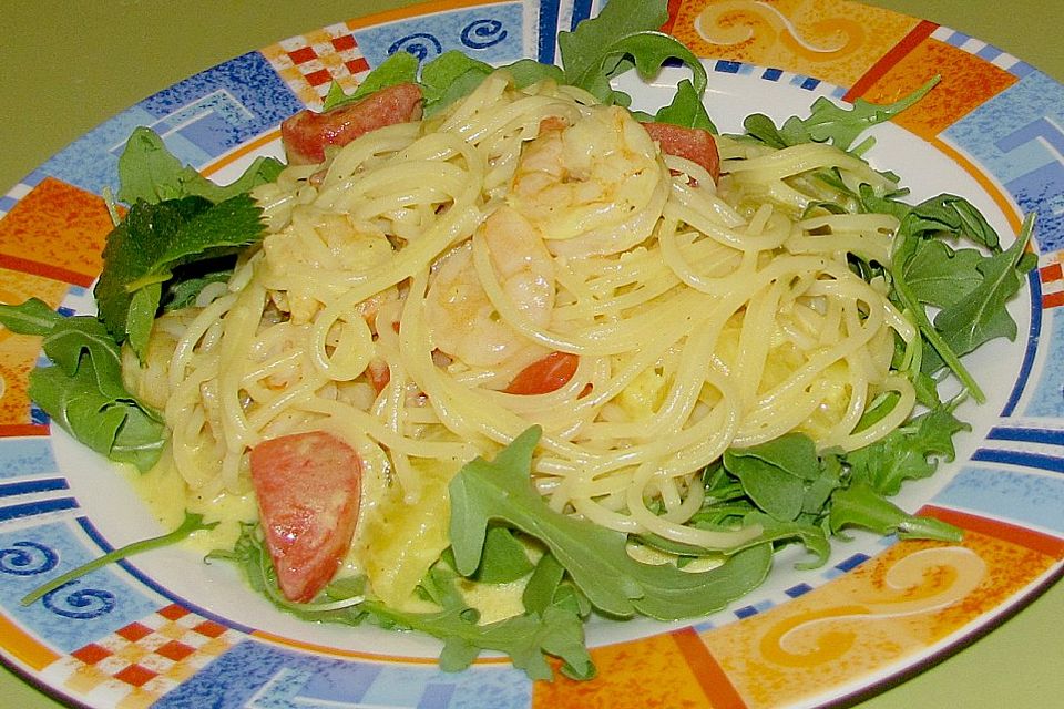 Spaghetti mit Riesengarnelen in Ananas - Ingwercreme auf Rucolabett