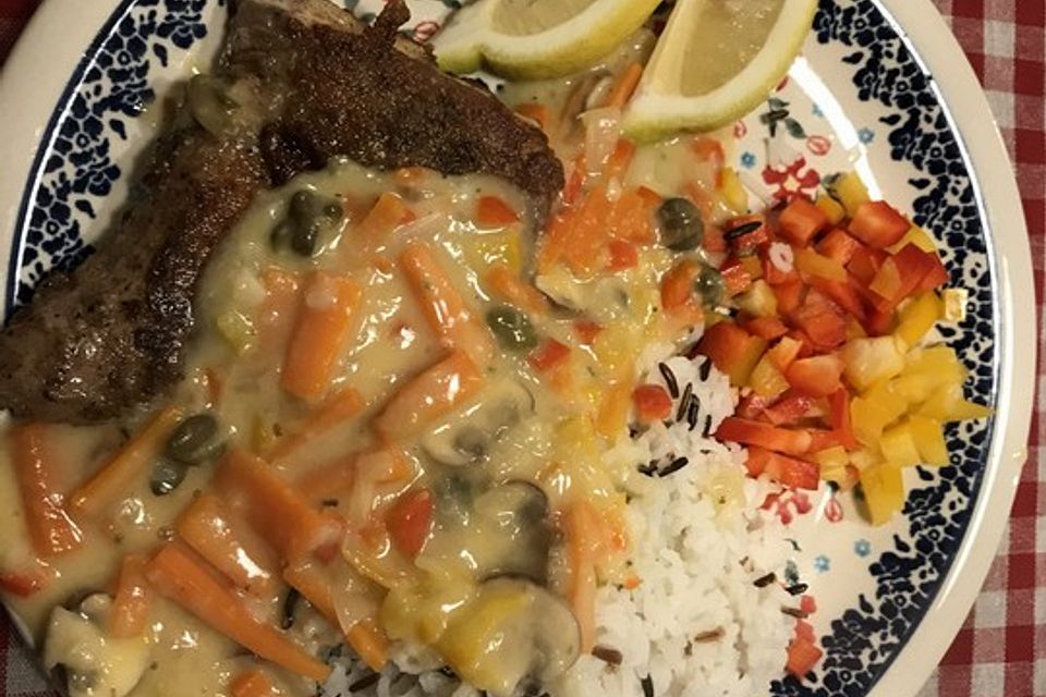 Welsfilet mit leckerer Champignon - Meerrettich - Sauce und Naturreis