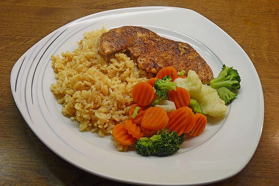 Naturschnitzel à la minute mit buntem Gemüse und Reis