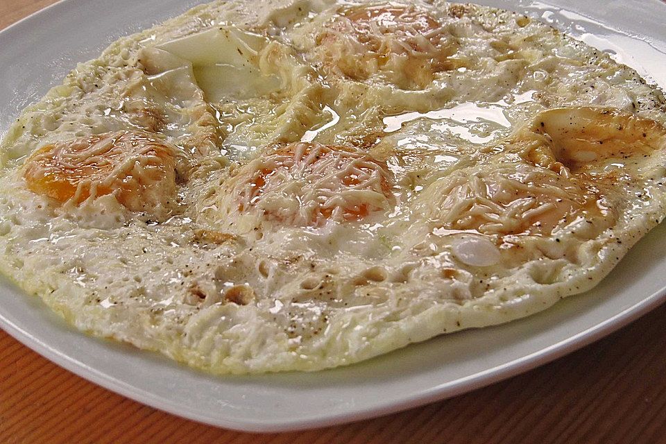 Spiegeleier mit Käse überbacken