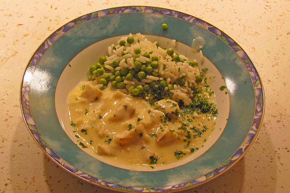 Rotbarschfilet in Sahne-Senfsauce mit Erbsenreis