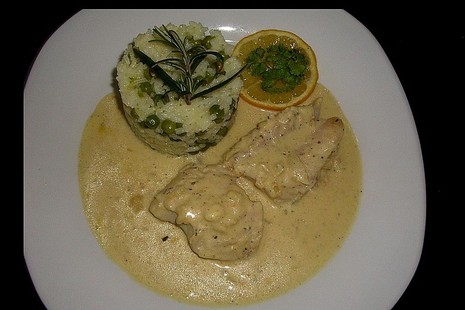 Rotbarschfilet in Sahne-Senfsauce mit Erbsenreis