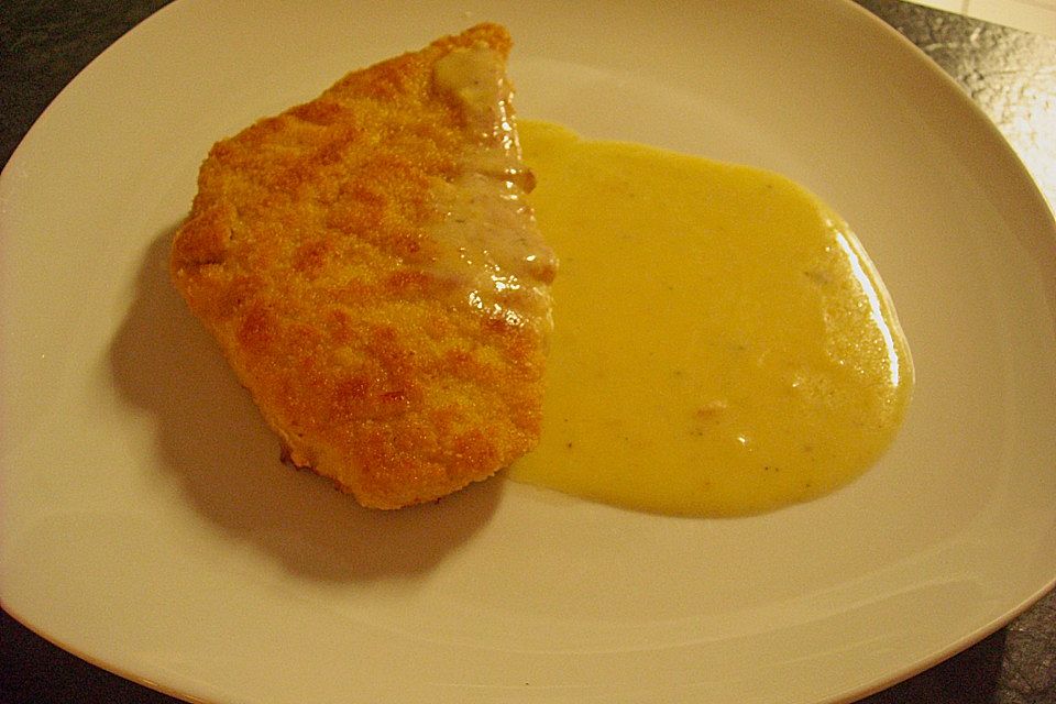 Paniertes Schnitzel mit Frischkäse - Sahne Sauce