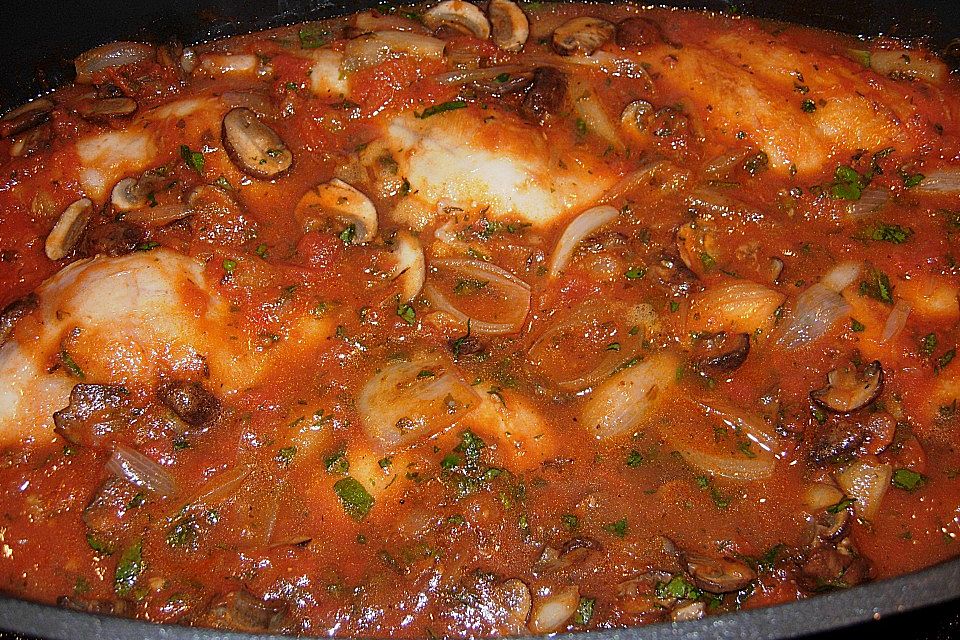 Kaninchen mit Schalotten in Tomatensauce