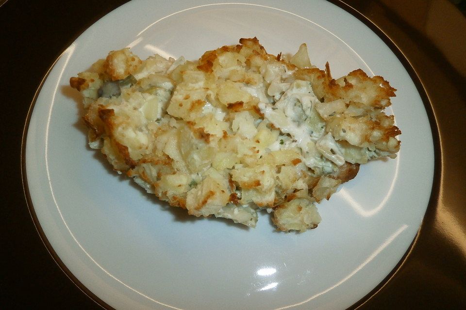 Putenschnitzel in Käse - Lauch - Sauce mit Rösti überbacken