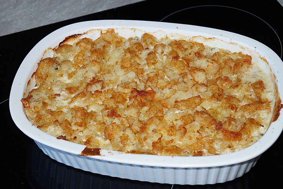 Putenschnitzel in Käse - Lauch - Sauce mit Rösti überbacken