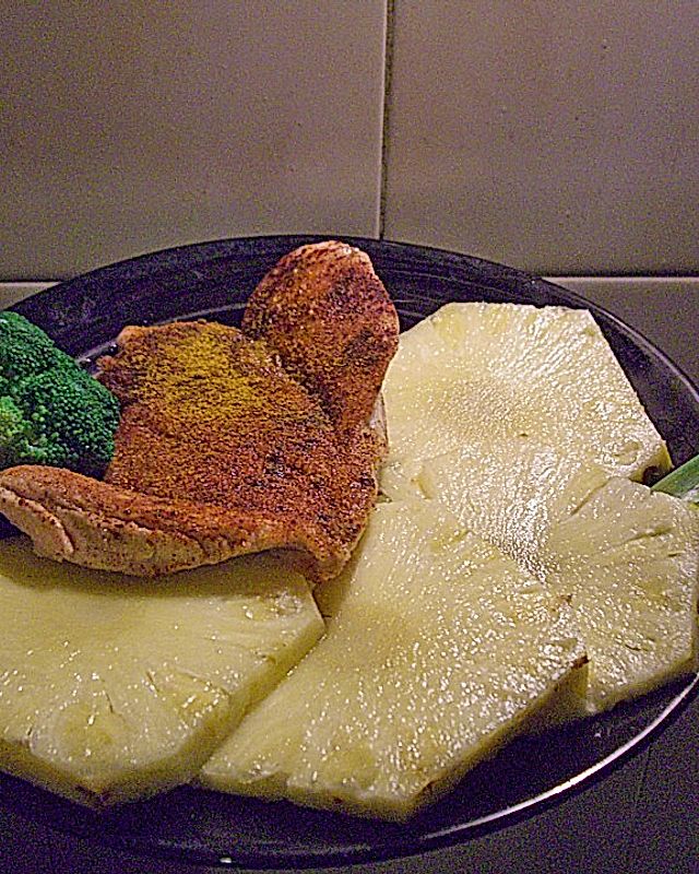 Putenschnitzel in Kokospanade