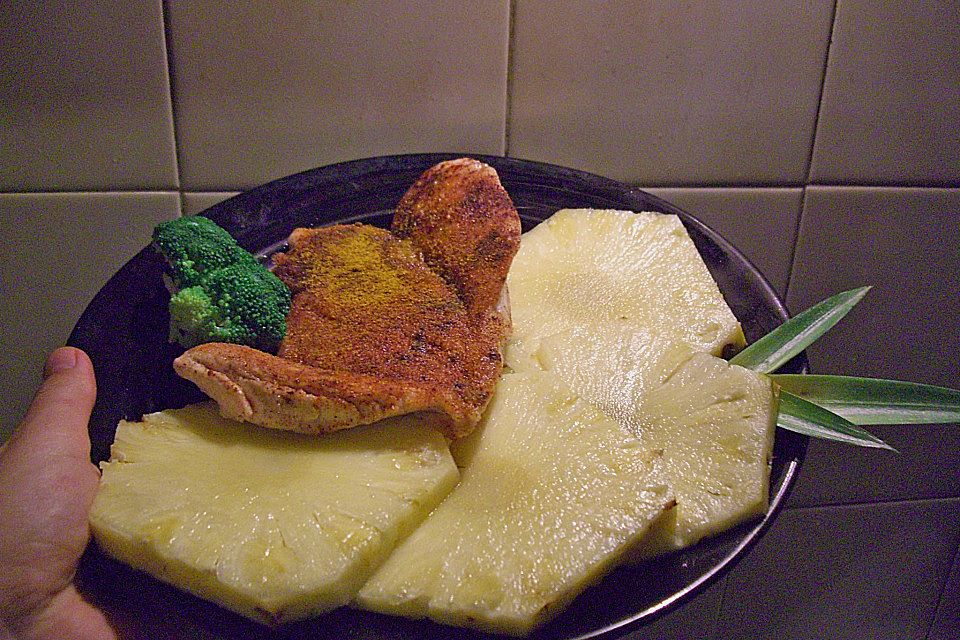 Putenschnitzel in Kokospanade