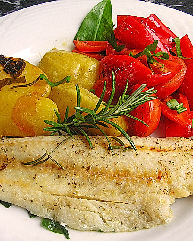 Fischfilet mediterran  mit Kartoffeln und Tomaten