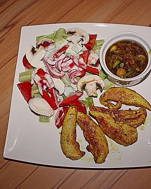 Curryhühnchen mit Orangensauce und Salat