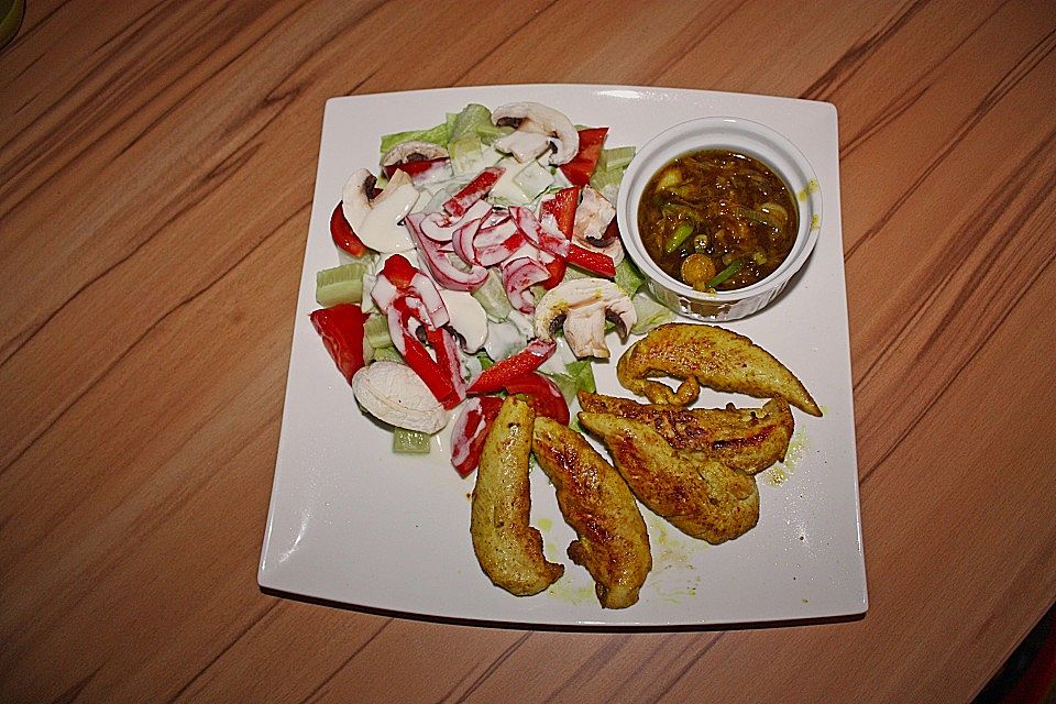 Curryhühnchen mit Orangensauce und Salat