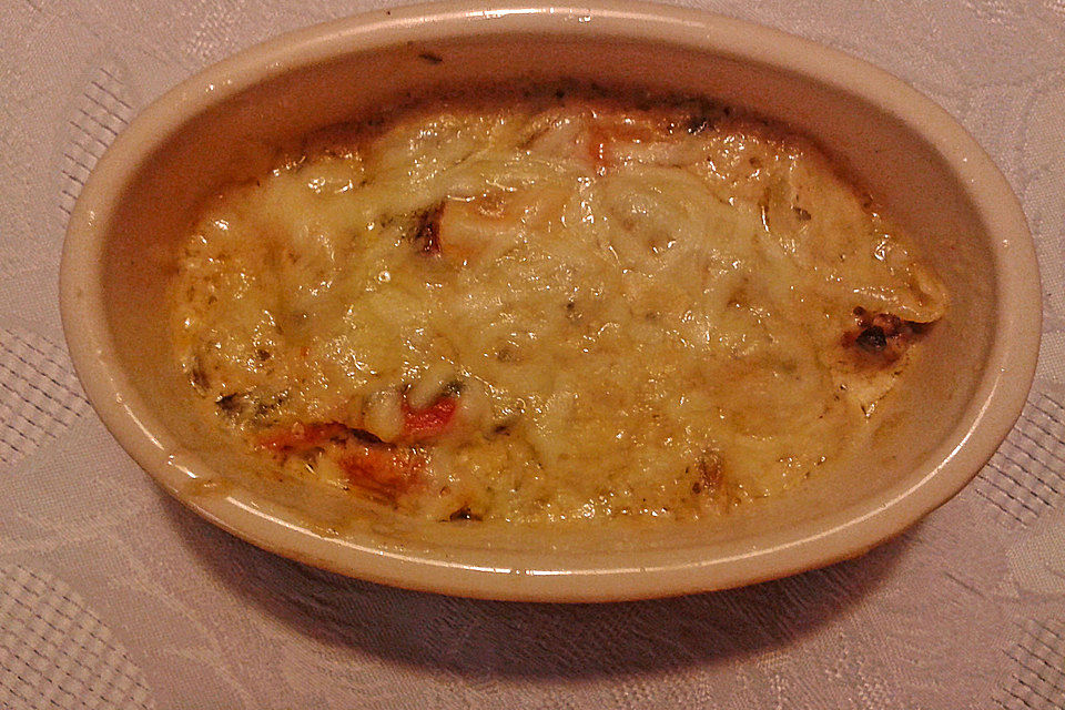 Muscheln in Sahnesoße mit Käse überbacken