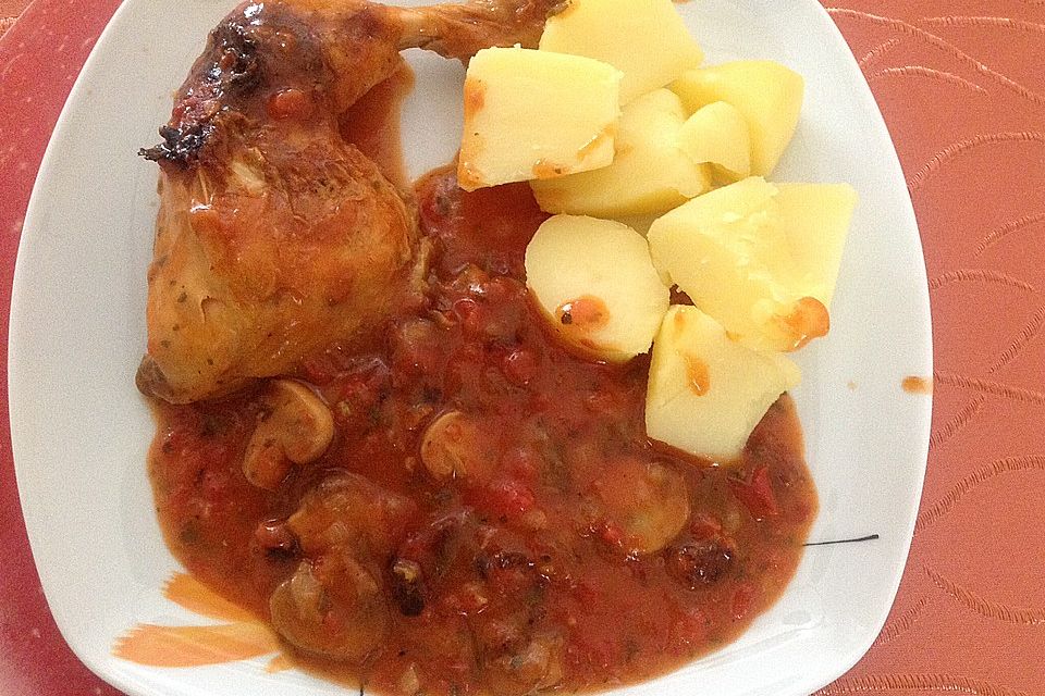 Geschmorte Hähnchenschenkel mit Champignons und Tomaten