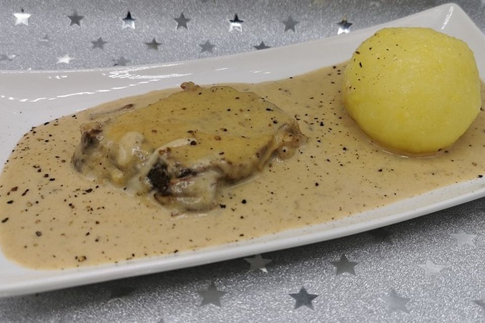 Schweinerücken in Orangen-Weißwein-Sauce