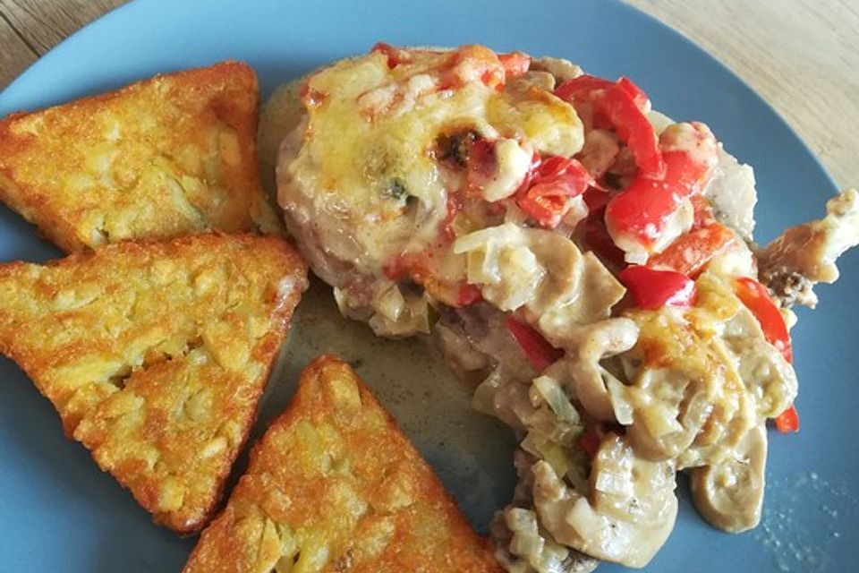 Überbackene Schnitzel in Paprika-Pilzrahm