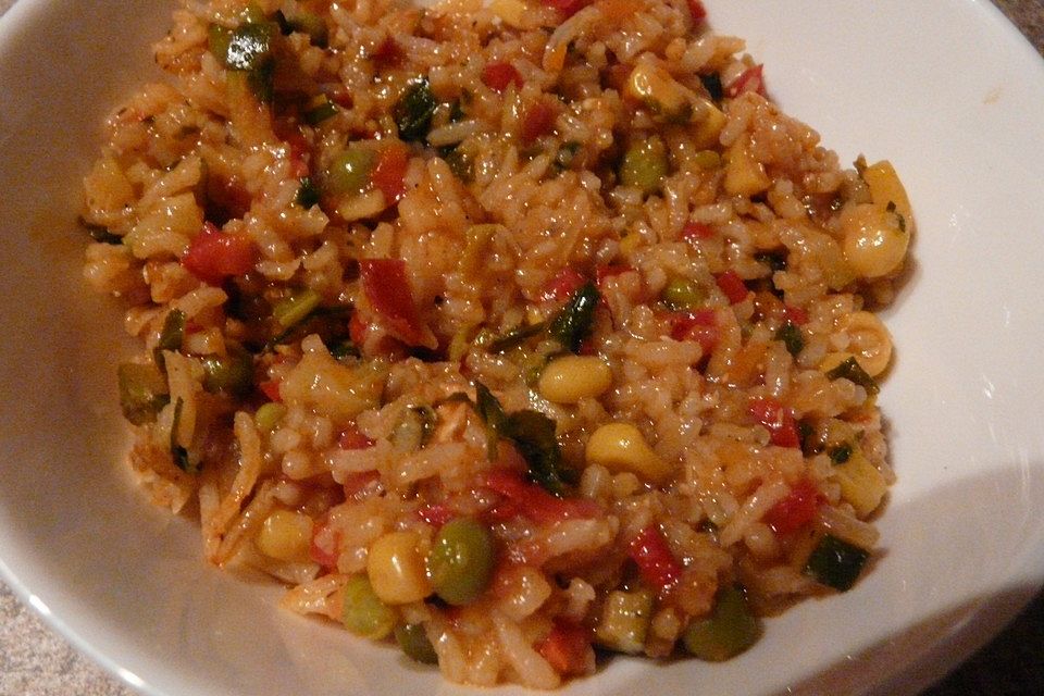 Reispfanne Jambalaya mit Putenstreifen und Garnelen