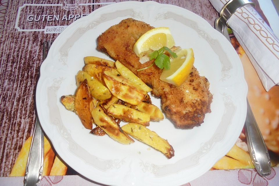 Schweineschnitzel mit Kartoffelspalten zitronig frisch