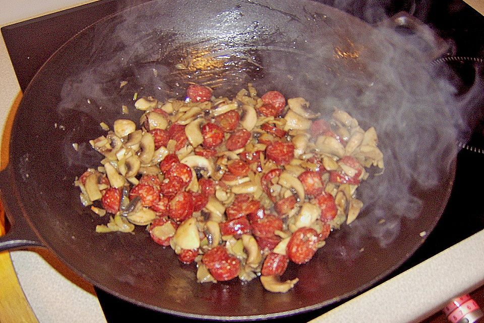 Risotto mit Salami und Erbsen