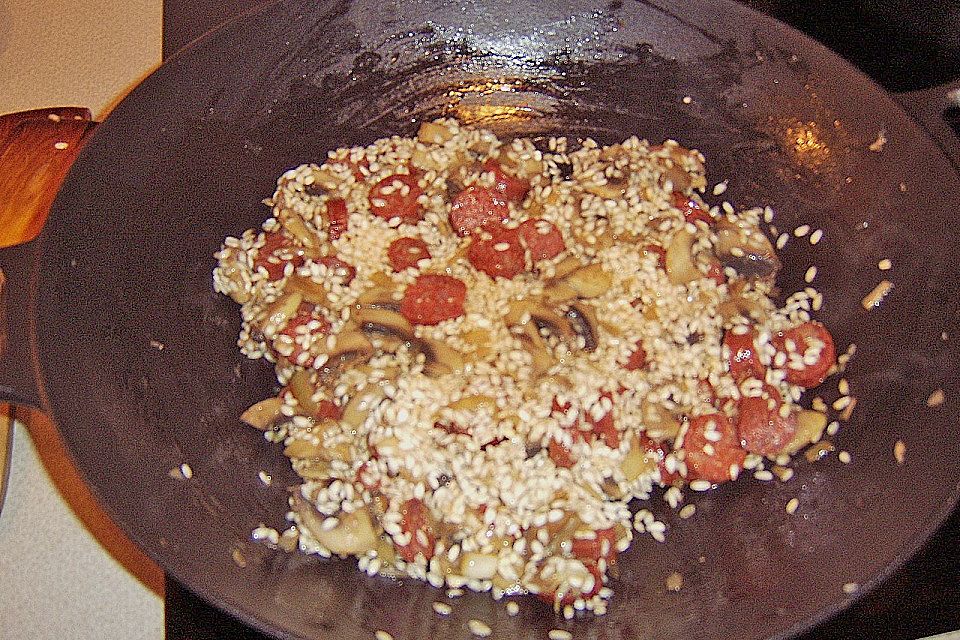 Risotto mit Salami und Erbsen