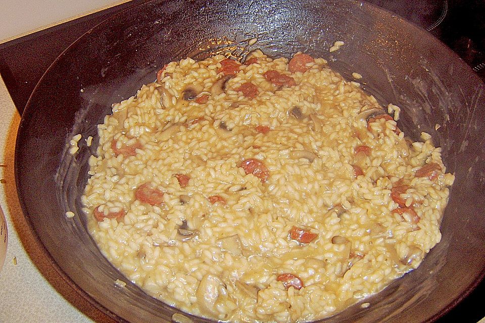 Risotto mit Salami und Erbsen