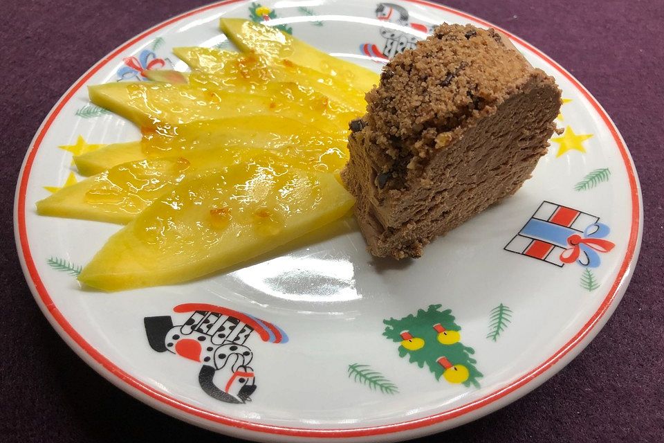 Weihnachtsdessert mit flambierten Orangen- oder Mangoscheiben