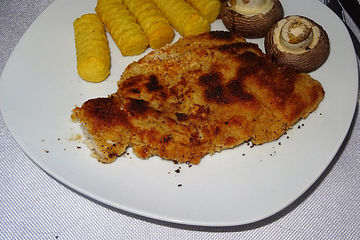 Schnitzel aus Kotelettfleisch mit Kroketten und Riesenchampignons à la Didi
