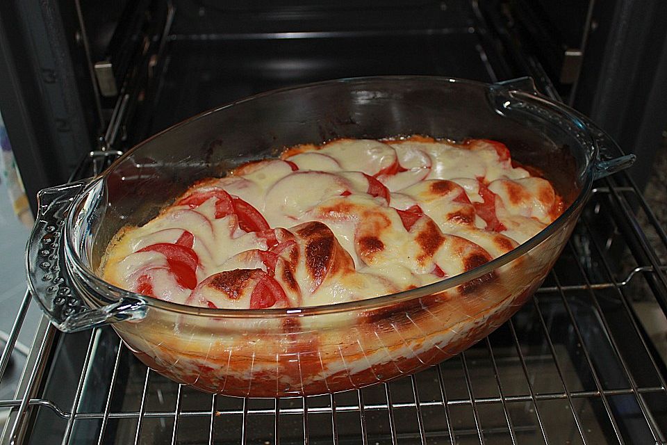 Schweinegeschnetzeltes mit Tomaten - Mozzarella - Haube