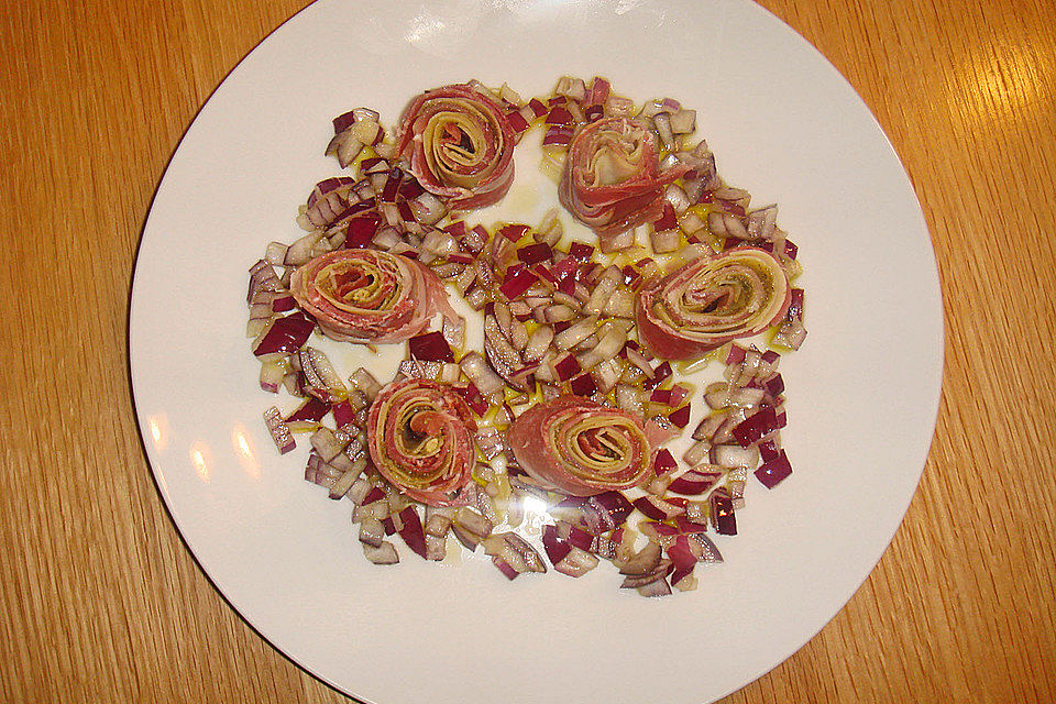 Parmaschinkenrolle auf Rucolasalat