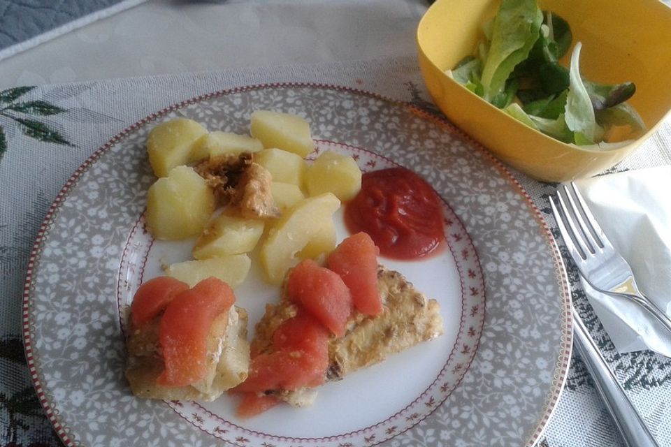 Fischfilet-Gratin mit Porree und Tomaten