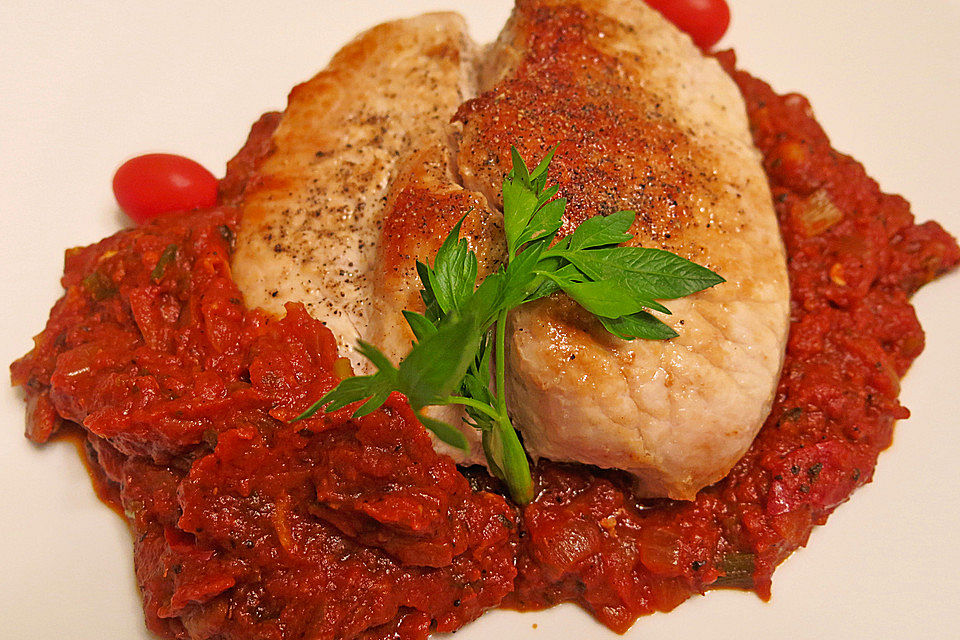 Schweinekoteletts mit Tomaten und Knoblauch