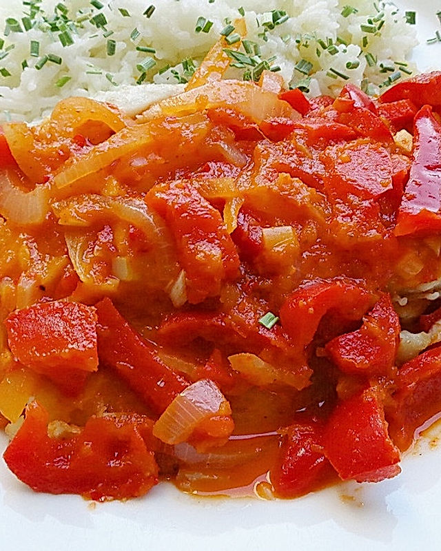 Seelachsfilet in Zwiebel - Paprika - Marinade mit Reis