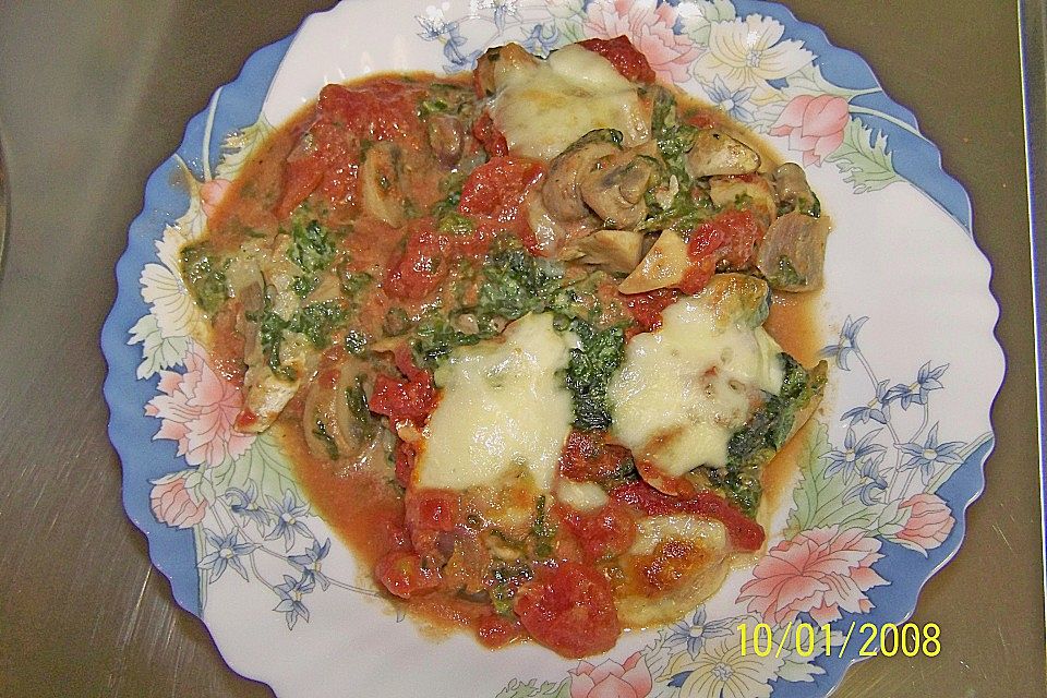 Kabeljau mit Spinat - Mozzarellakruste auf Tomatensoße