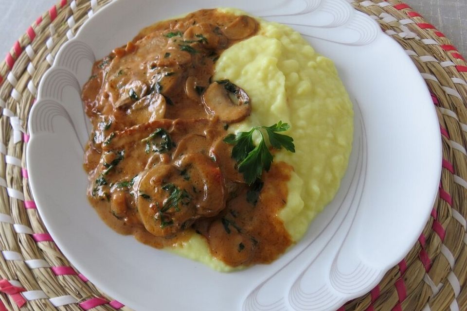 Schweineschnitzel mit Kräuter - Champignons